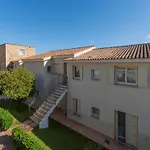 Complex Surrounded By Greenery With Pool