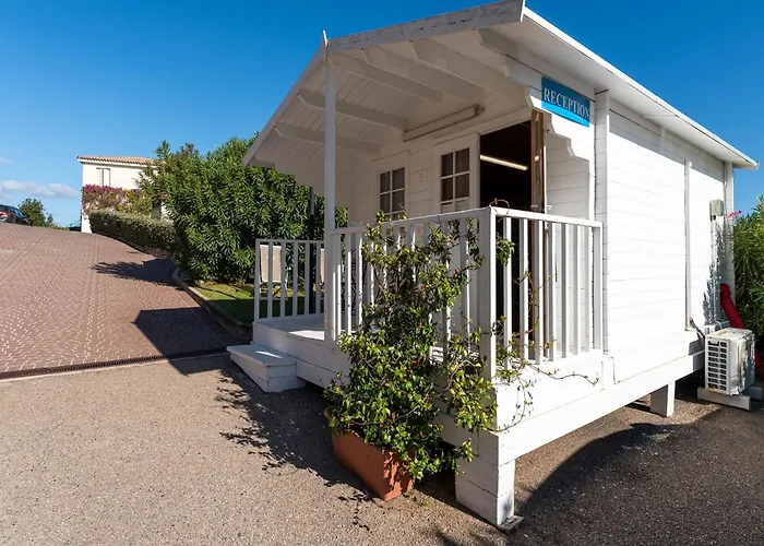 Complex Surrounded By Greenery With Pool *