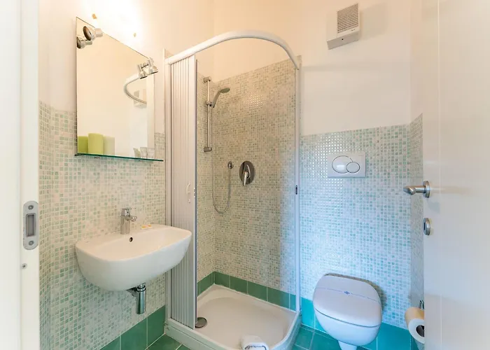 Complex Surrounded By Greenery With Pool